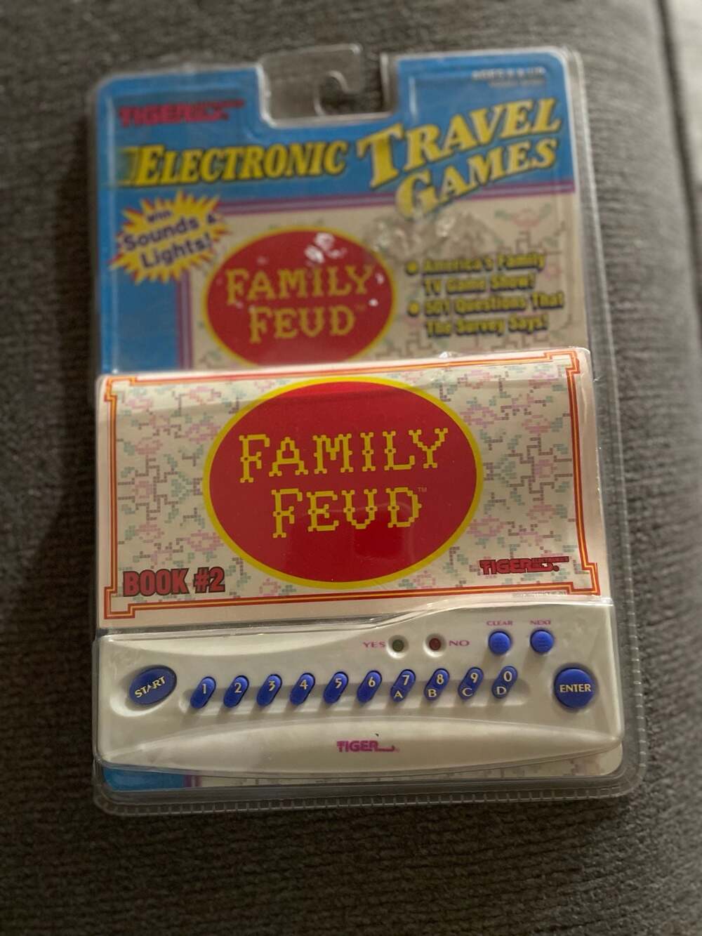 1997 Tiger Electronics Family Feud Electronic Travel Game Book #2